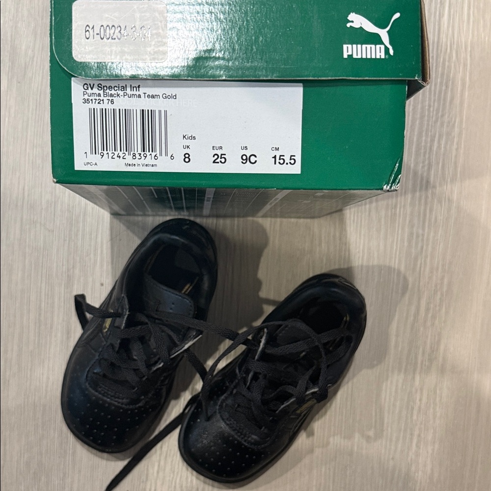 Puma Kids Black Sneakers with Gold Highlights